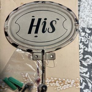 Metal His and Hers hangers/hooks.